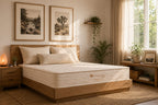 Bedroom with an organic mattress by Lifekind on a bed, framed pictures on the wall, and plants.