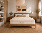 Bedroom with an organic latex mattress by Lifekind, wooden wardrobe, and decorative elements.