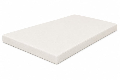 Beige organic latex mattress topper by Lifekind on a white background.